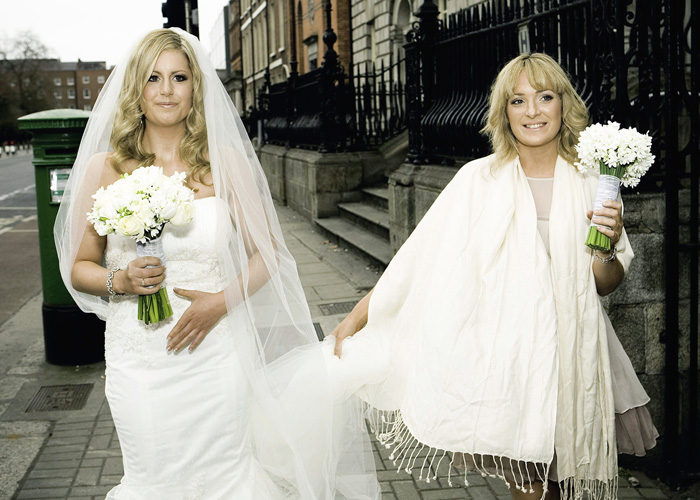 bride and bridesmaid walking 